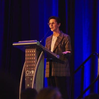 Roberta Muller of Northstar Travel Group speaks at OX9
